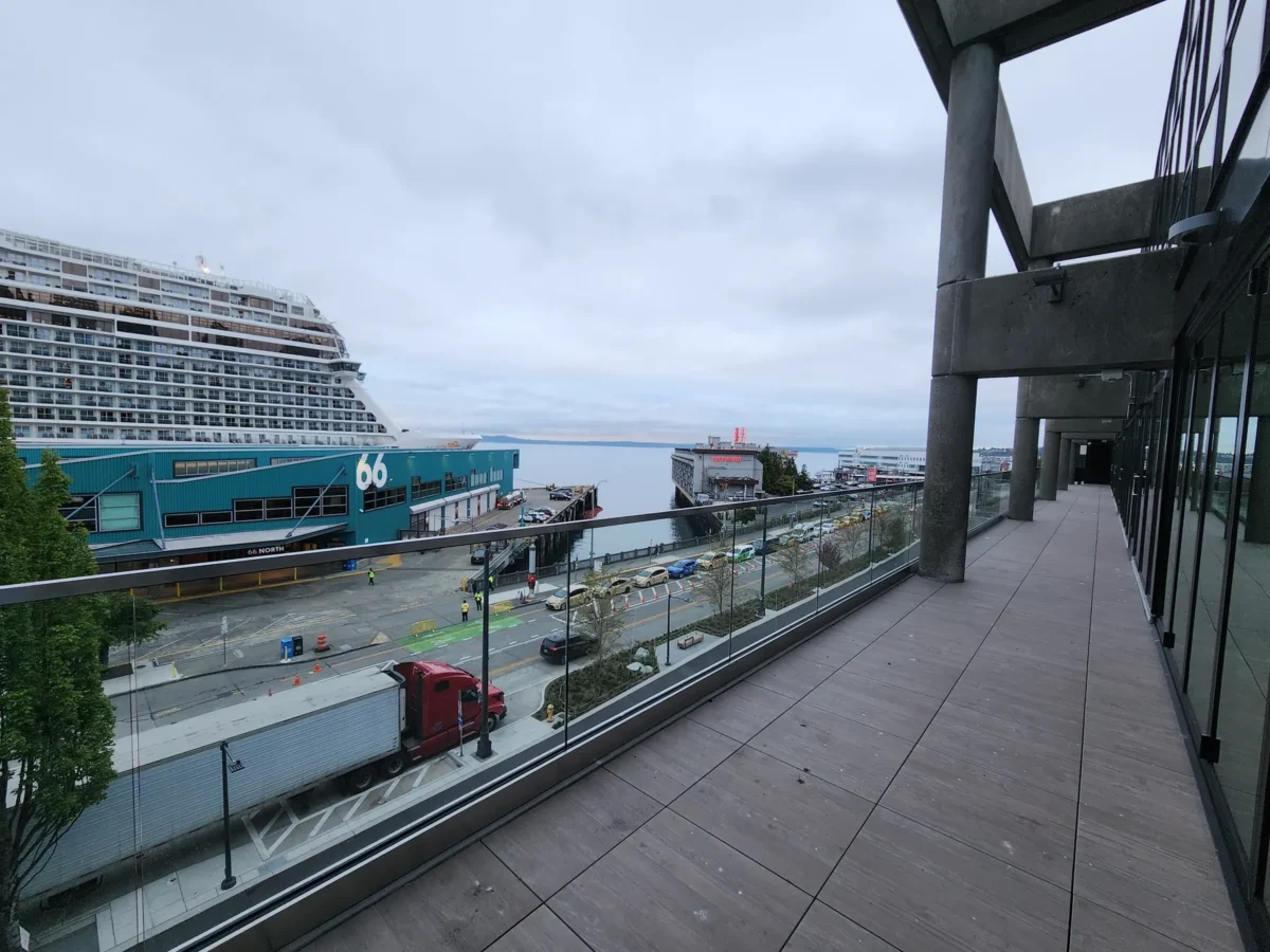 Curtain wall and glazed elevations at 2323 Elliott, with a terrace looking out over the water.