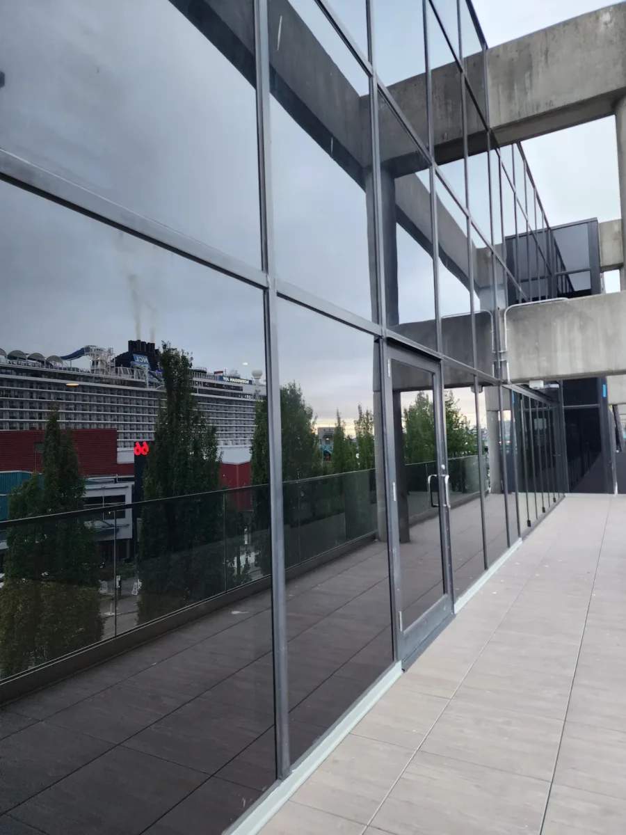 Curtain wall and glazed elevations at 2323 Elliott, with a terrace looking out over the water.
