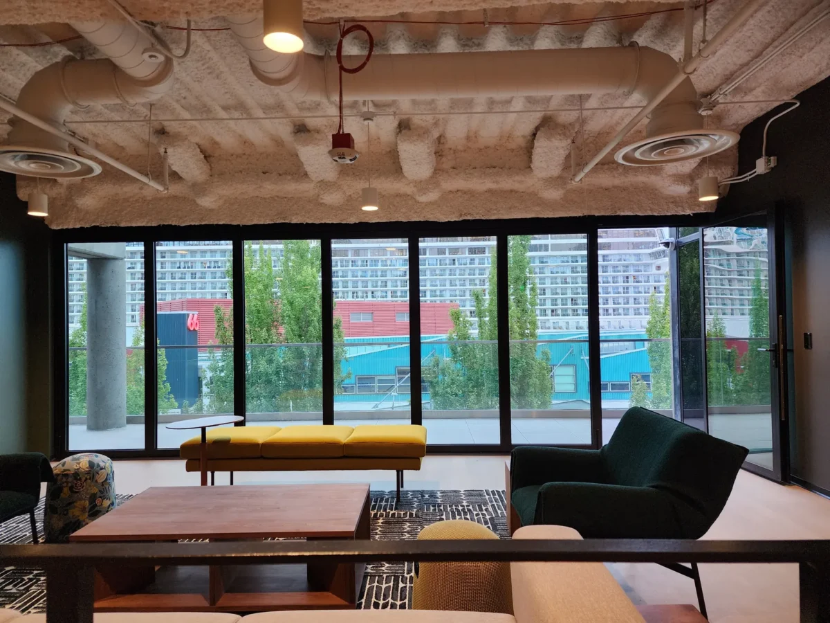 Curtain wall and glazed elevations at 2323 Elliott, with a terrace looking out over the water.