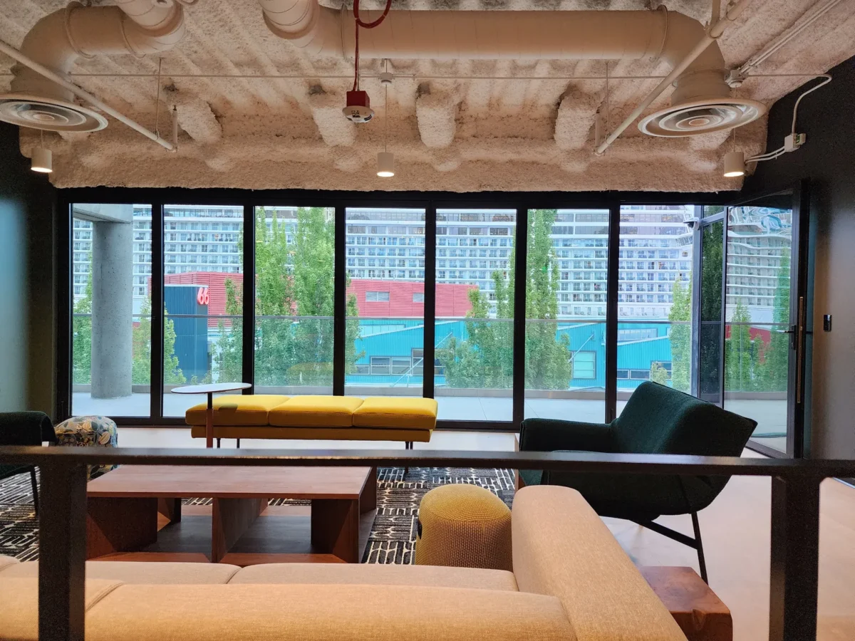 Curtain wall and glazed elevations at 2323 Elliott, with a terrace looking out over the water.