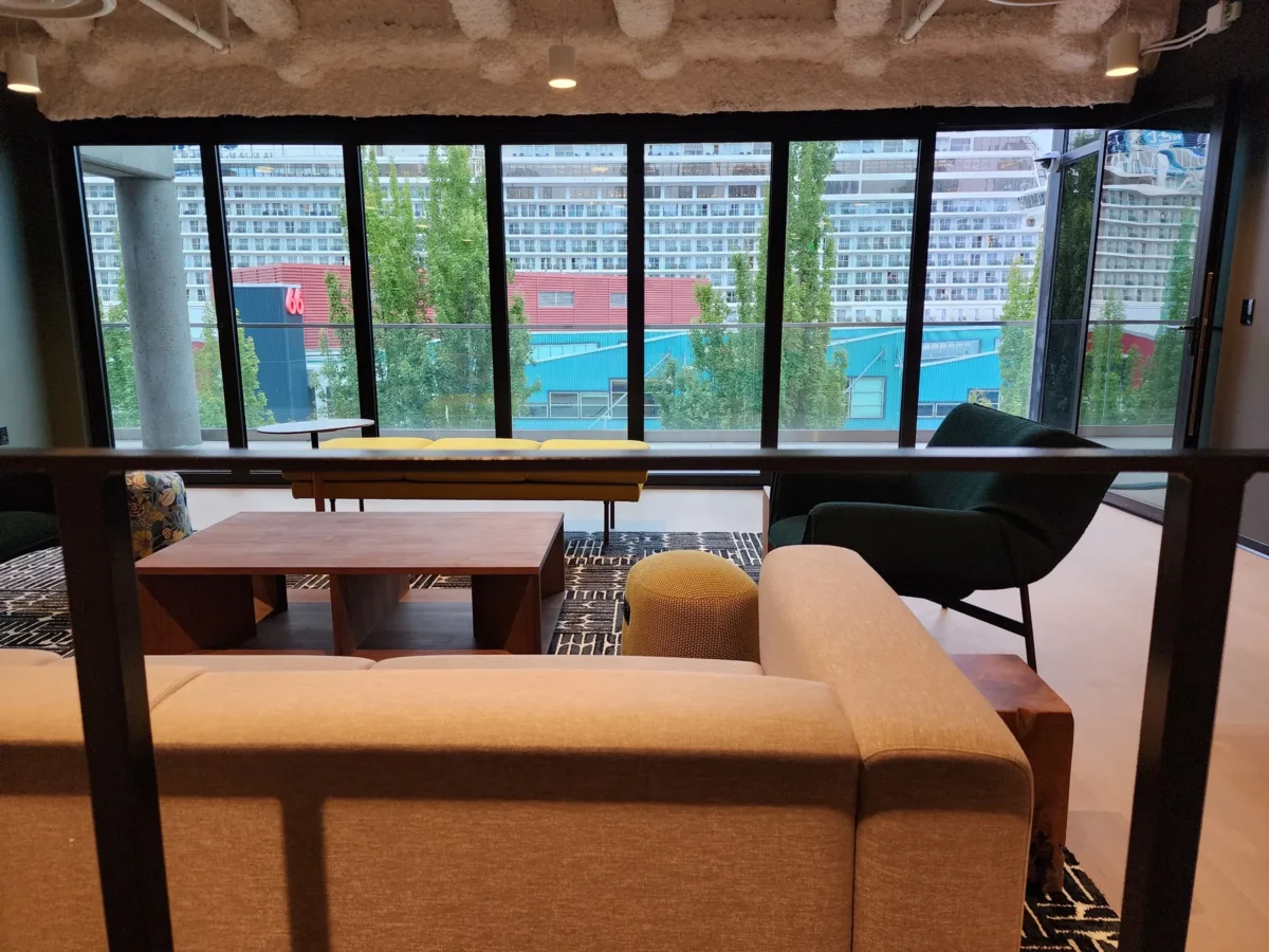 Curtain wall and glazed elevations at 2323 Elliott, with a terrace looking out over the water.