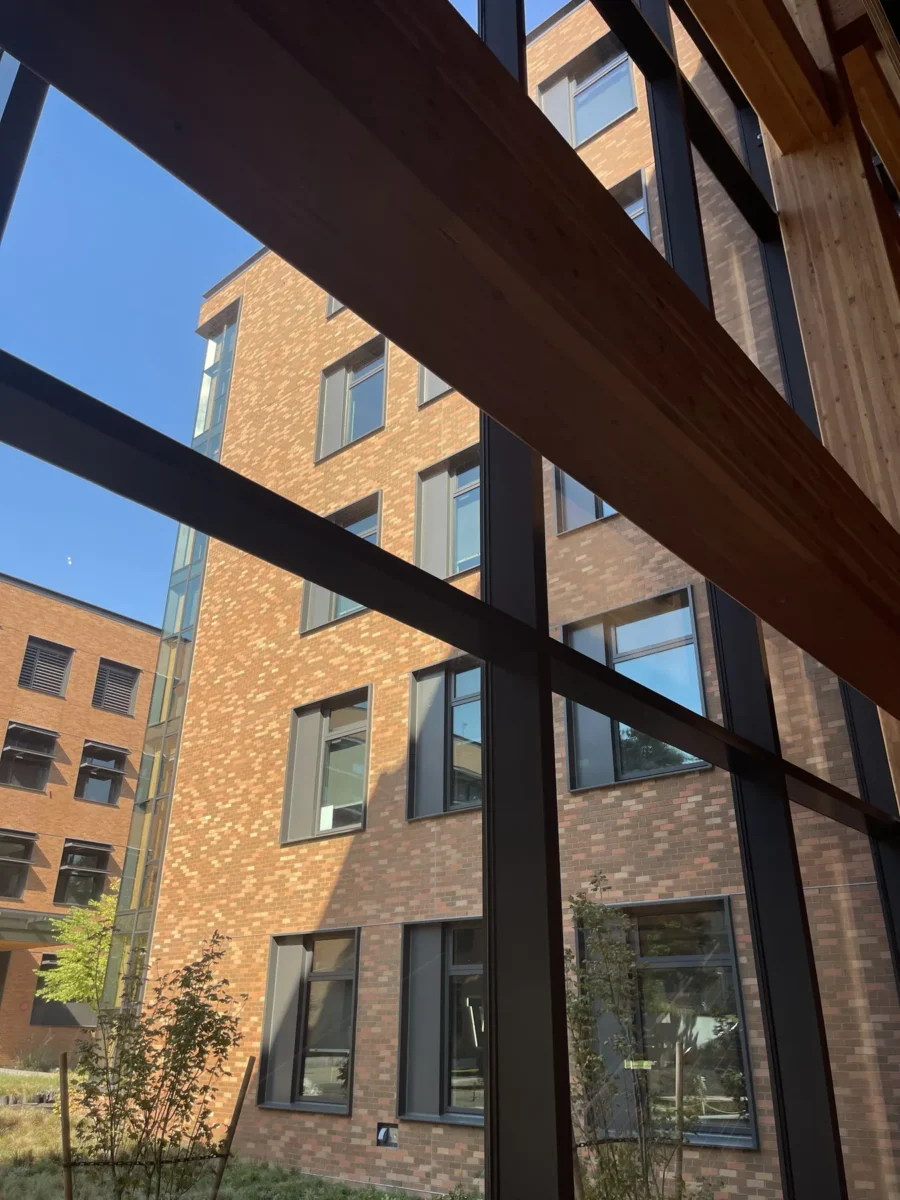 Glazing at Founders Hall: storefront, glass doors and interior glass in a mass timber building.