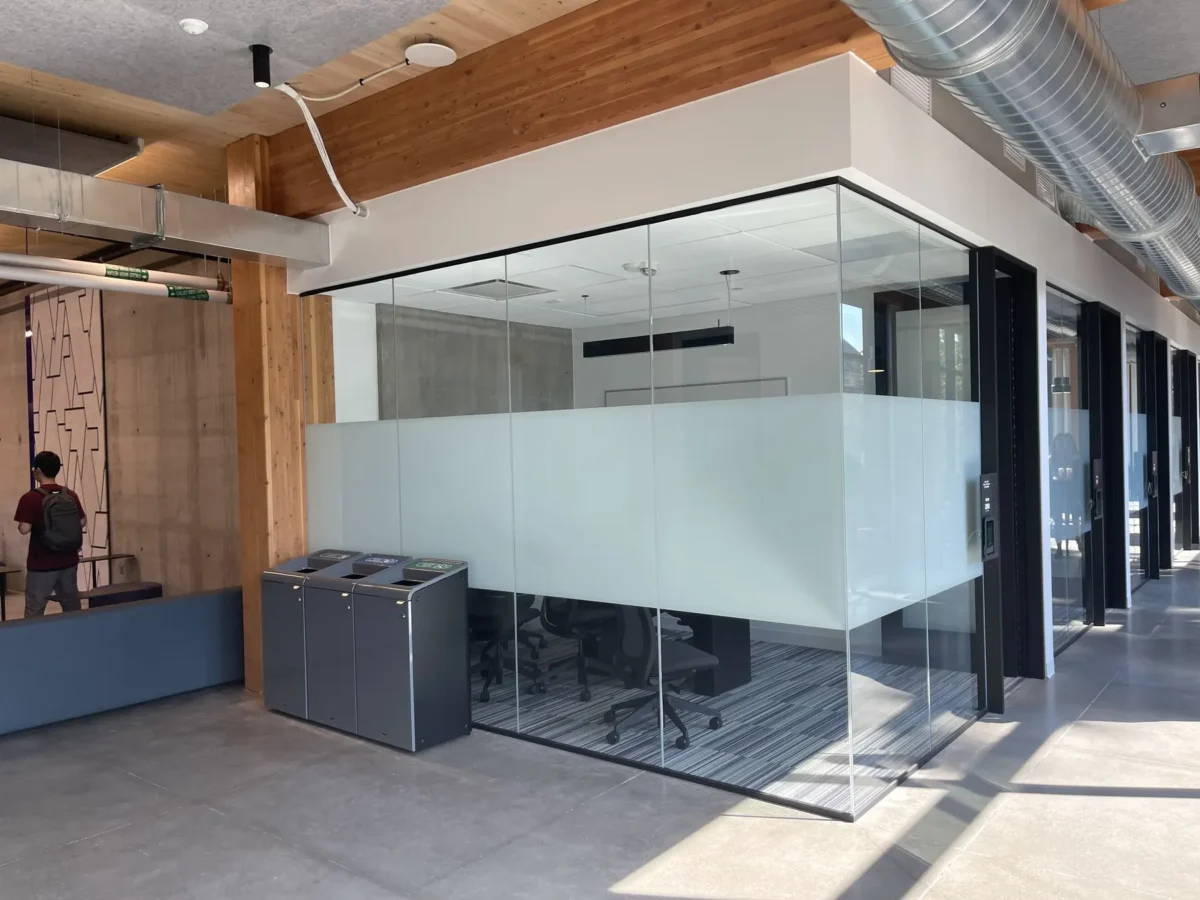Glazing at Founders Hall: storefront, glass doors and interior glass in a mass timber building.