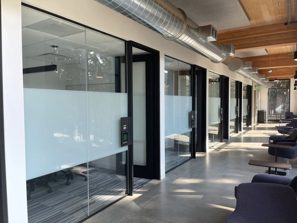 Glazing at Founders Hall: storefront, glass doors and interior glass in a mass timber building.