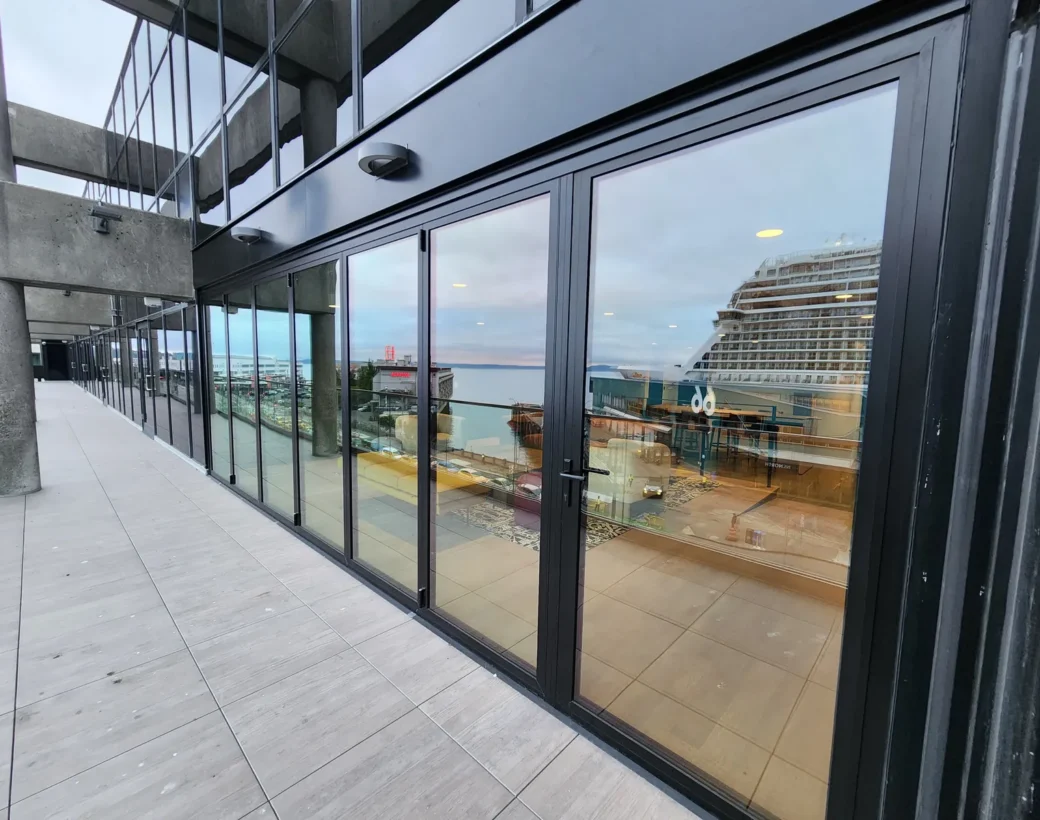 Sliding glass wall opening onto a terrace at 2323 Elliott