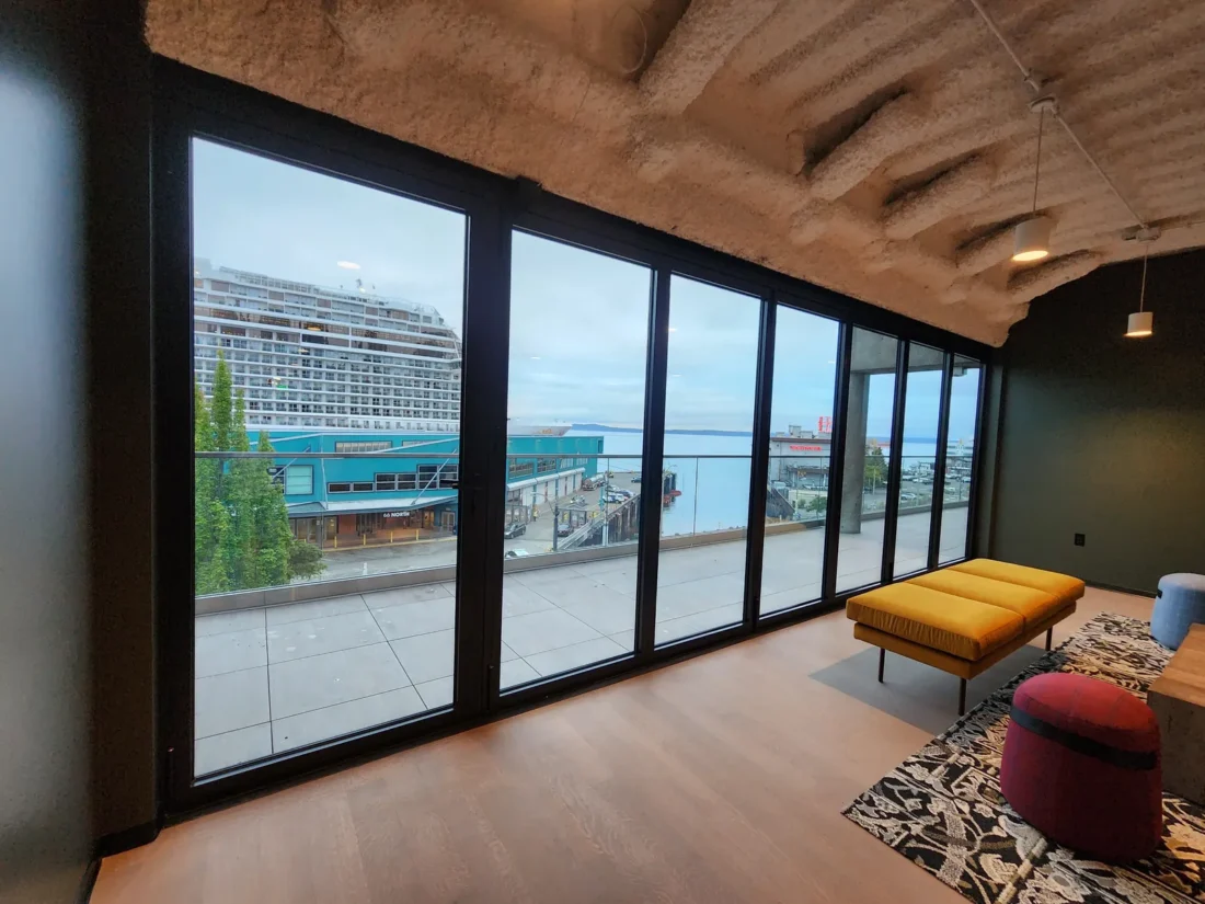Floor-to-ceiling window wall overlooking Elliott Bay at 2323 Elliott