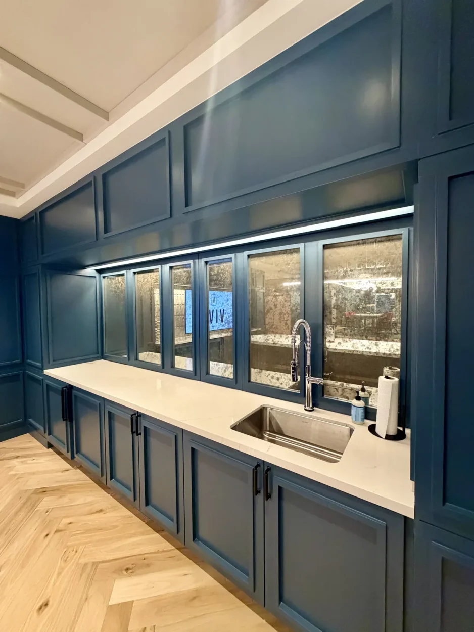 Custom antique mirror glass set into painted casework