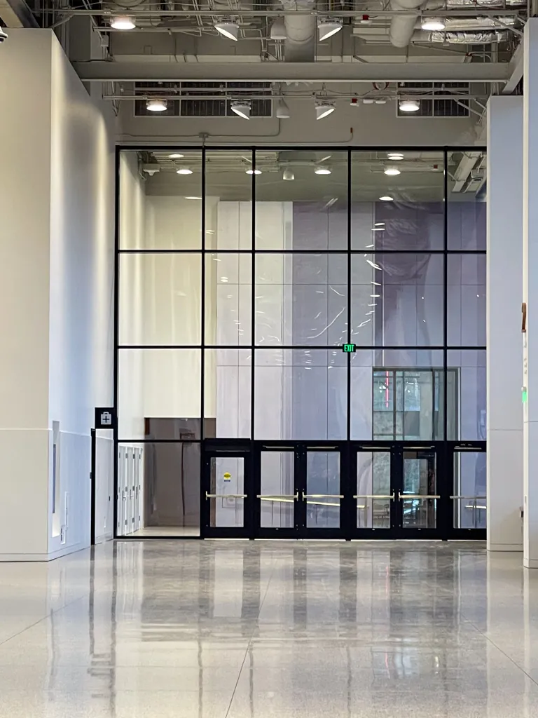 Floor-to-ceiling interior glass wall and entrance doors at the Seattle Convention Center Summit