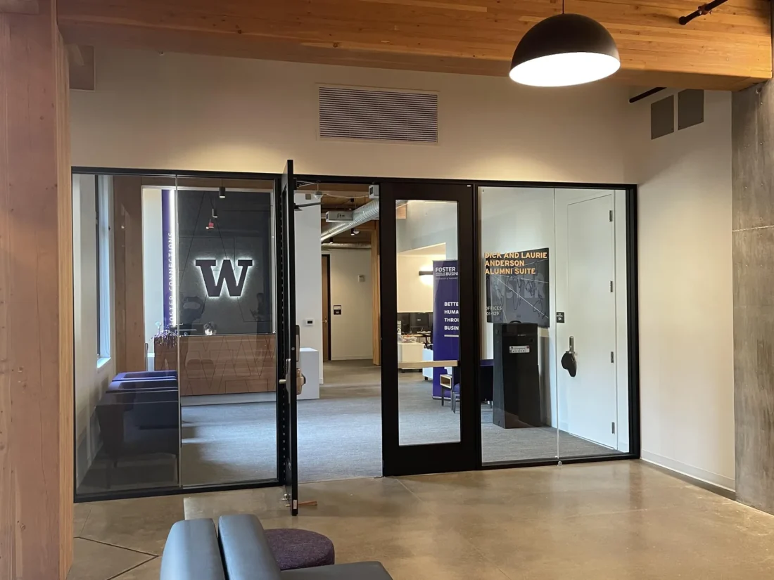 Black-framed glass entrance doors and sidelites at Founders Hall