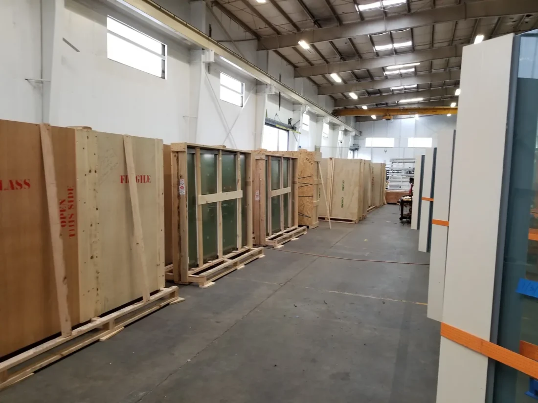 Crated glass units staged in the Herzog Glass shop