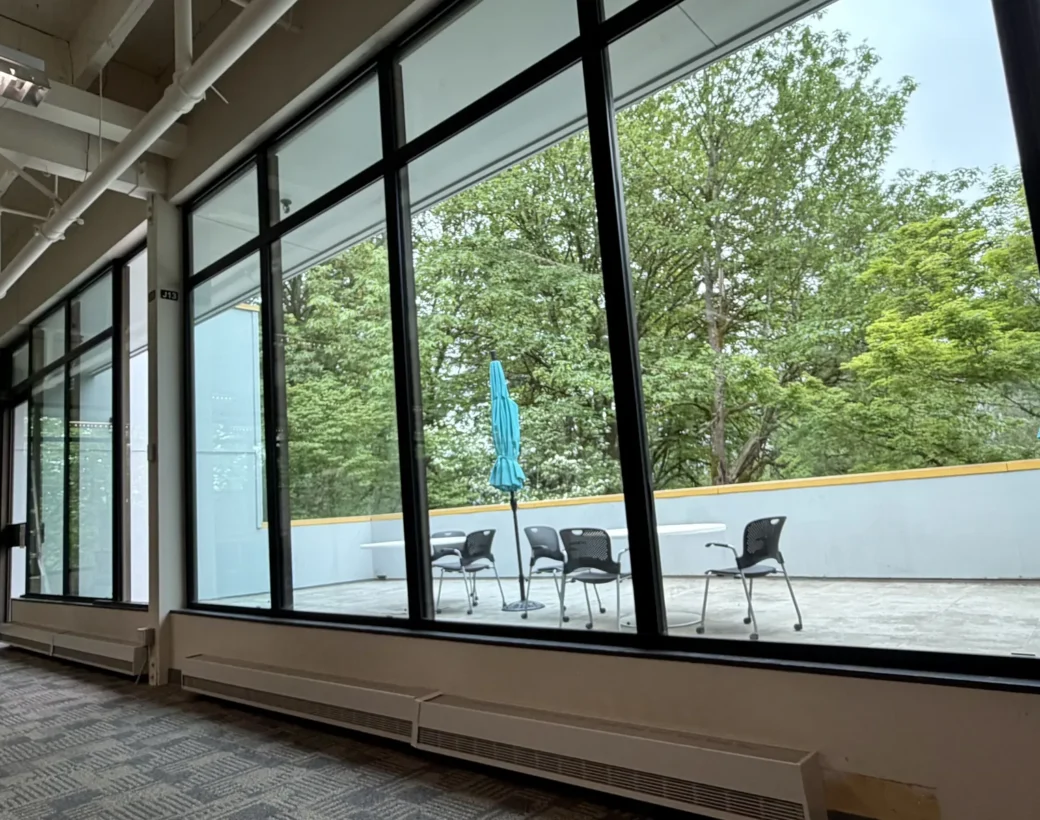 Replaced window wall looking onto a patio at the Stryker building