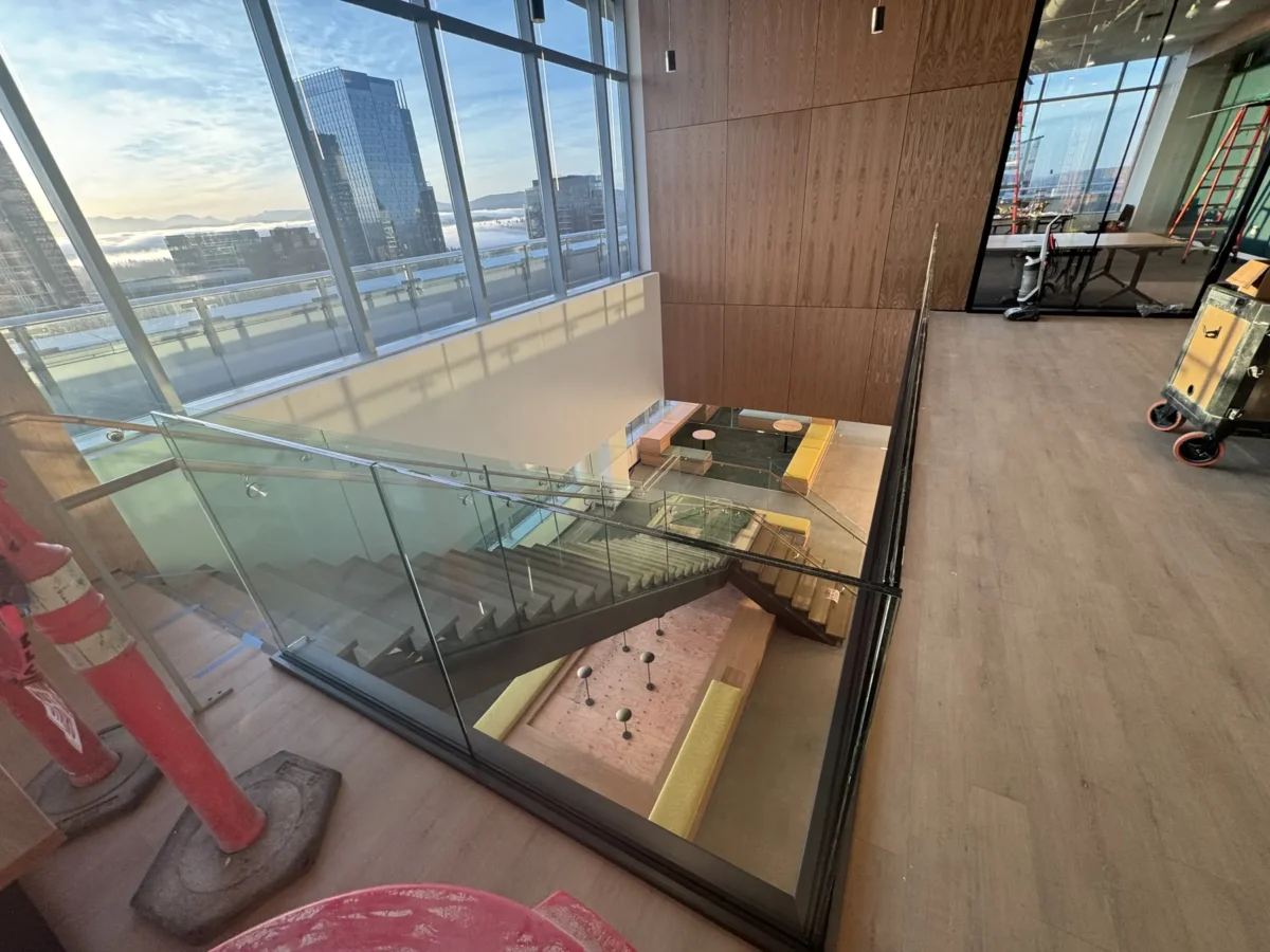 Interior glass partitions and glass stair rails at the Lincoln Square tenant improvement in Bellevue.