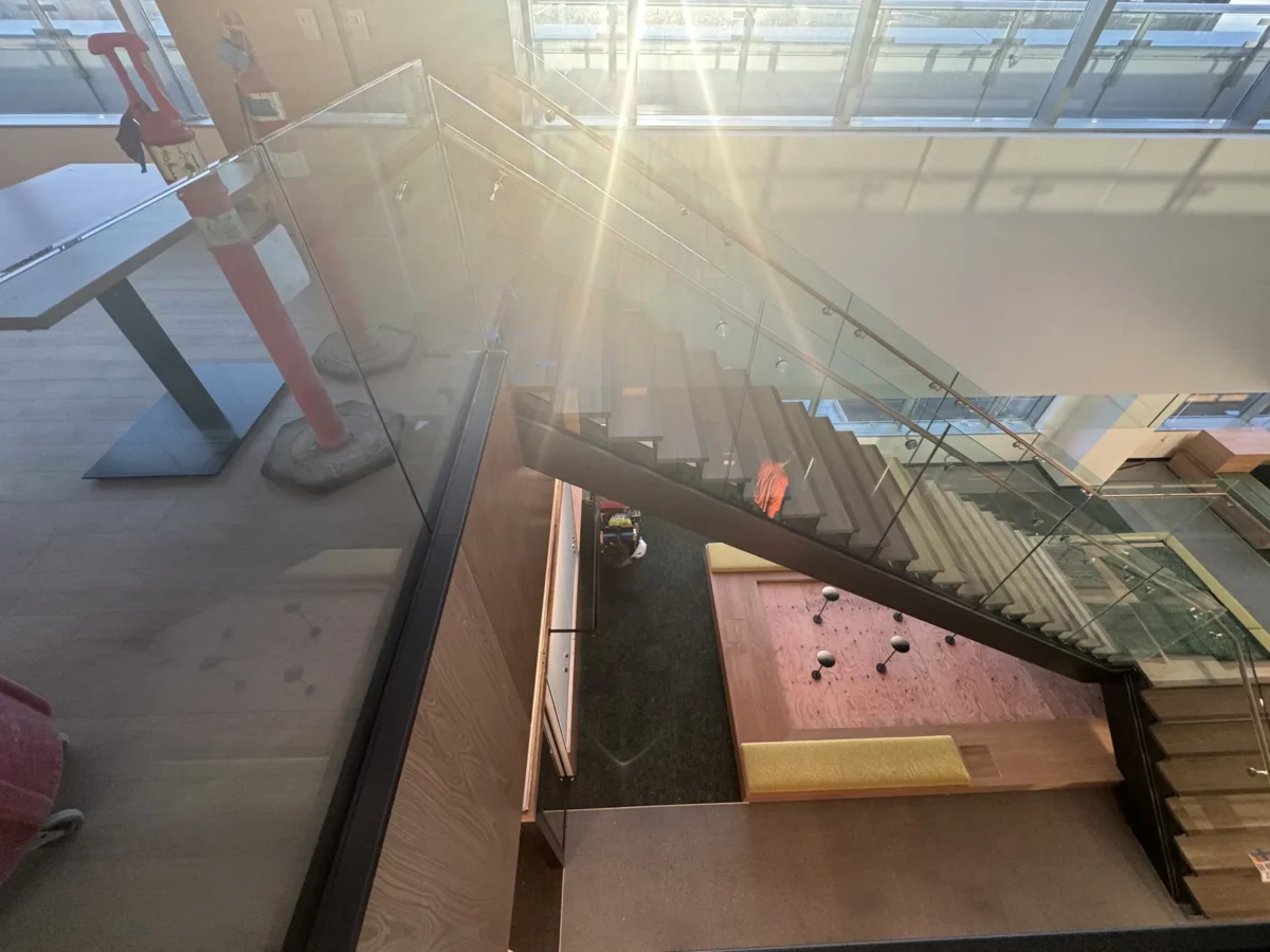 Interior glass partitions and glass stair rails at the Lincoln Square tenant improvement in Bellevue.
