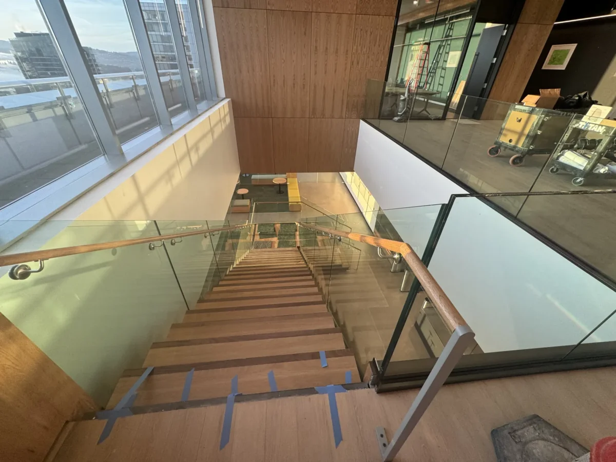 Interior glass partitions and glass stair rails at the Lincoln Square tenant improvement in Bellevue.