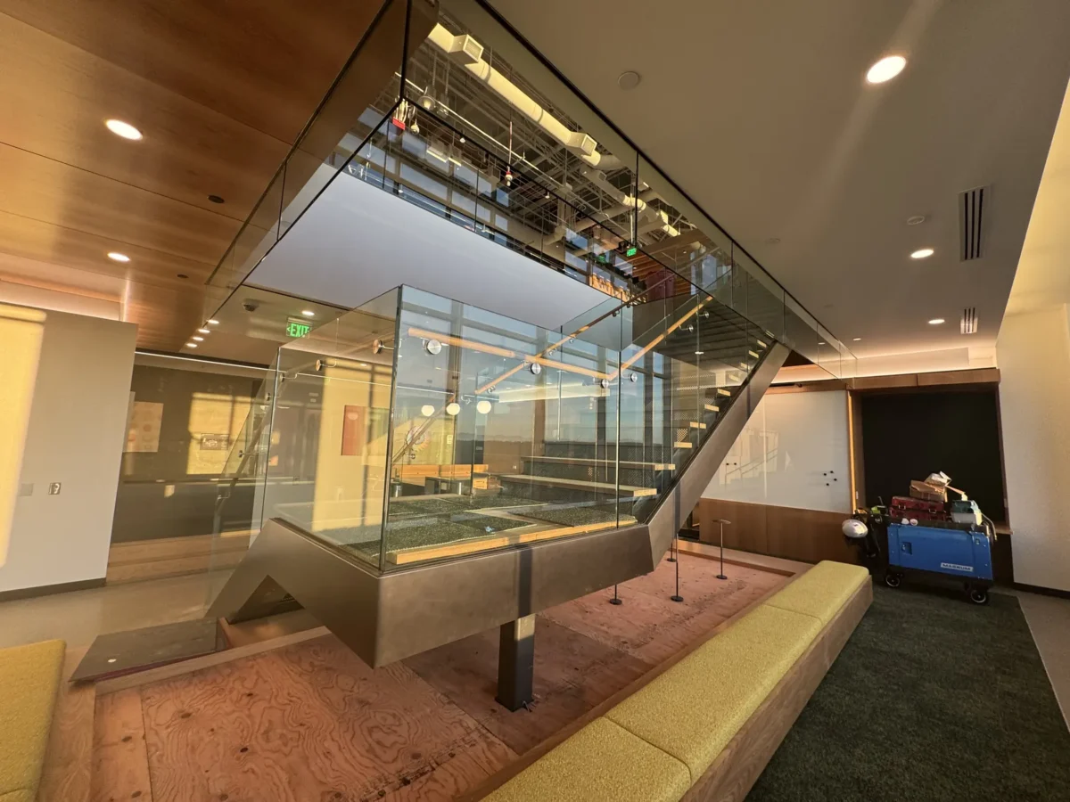 Interior glass partitions and glass stair rails at the Lincoln Square tenant improvement in Bellevue.