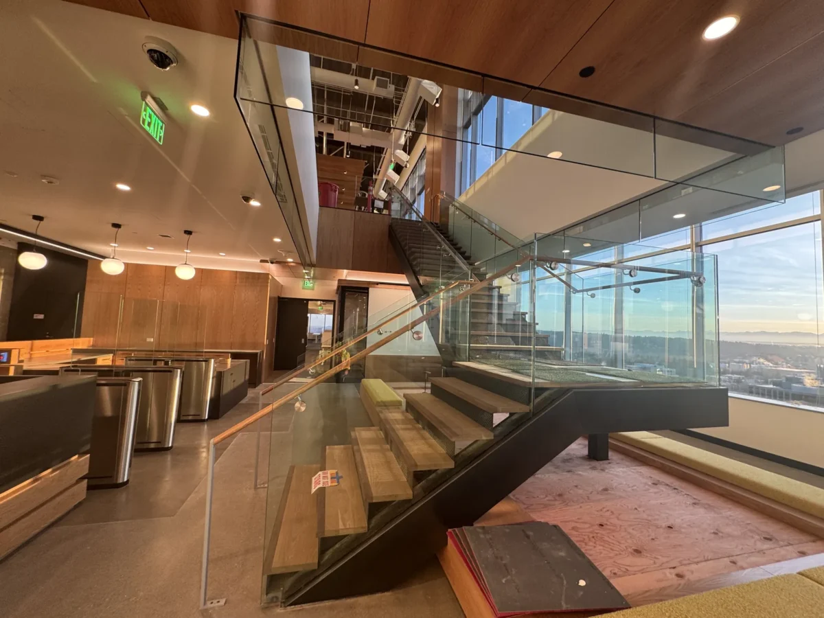 Interior glass partitions and glass stair rails at the Lincoln Square tenant improvement in Bellevue.