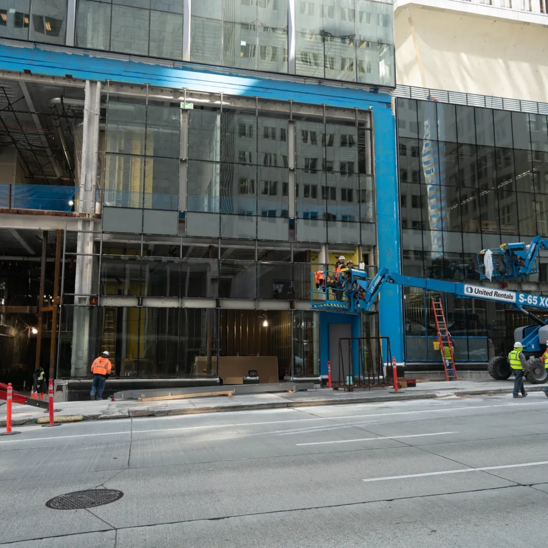 Curtain wall installation at street level at Rainier Tower in downtown Seattle.