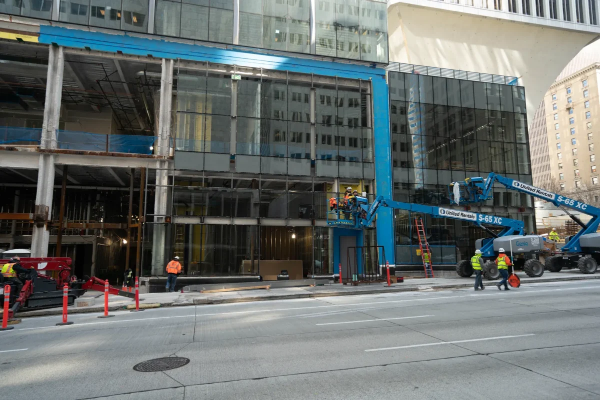 Curtain wall installation at street level at Rainier Tower in downtown Seattle.