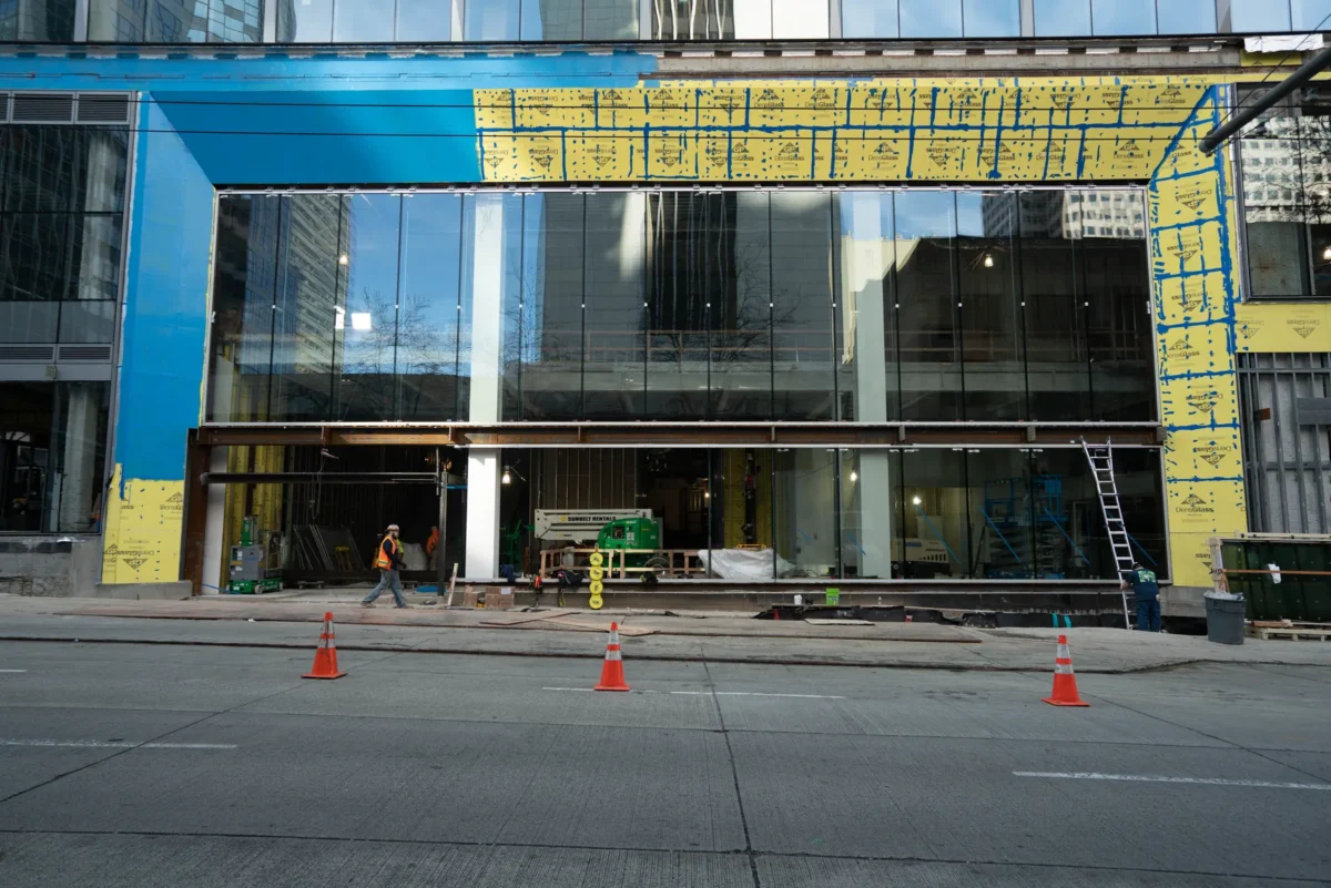 Curtain wall installation at street level at Rainier Tower in downtown Seattle.