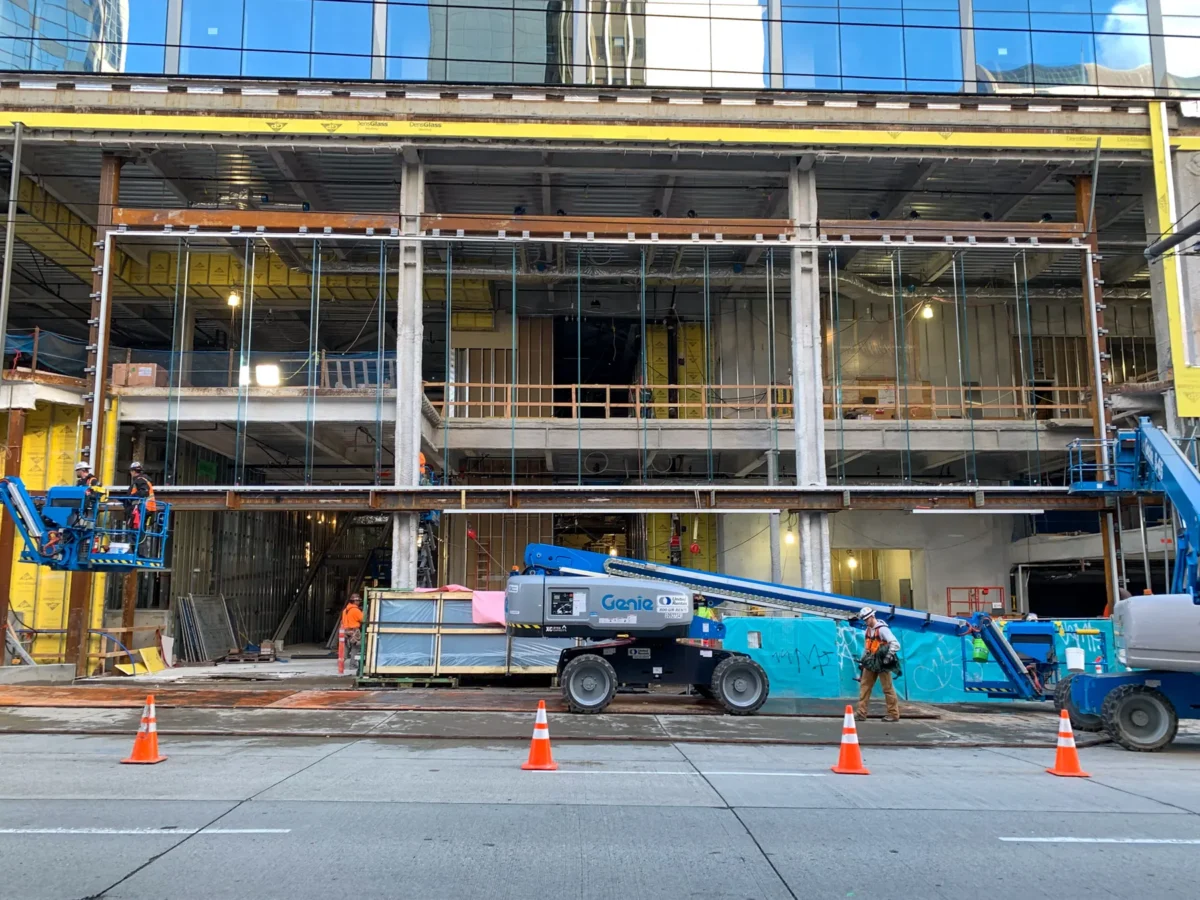 Curtain wall installation at street level at Rainier Tower in downtown Seattle.