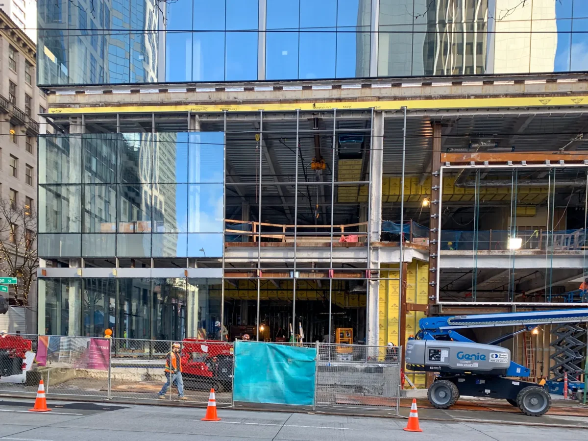 Curtain wall installation at street level at Rainier Tower in downtown Seattle.