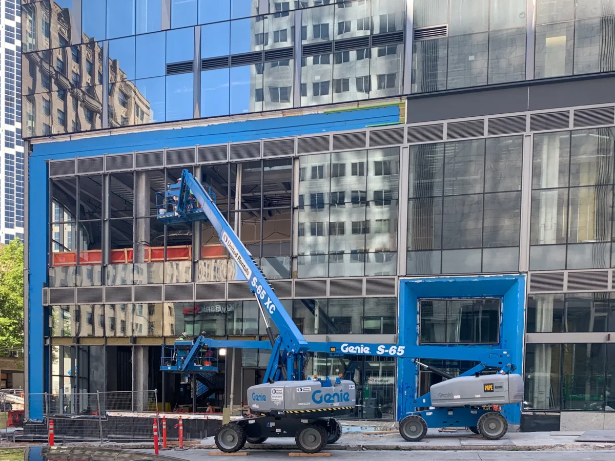Curtain wall installation at street level at Rainier Tower in downtown Seattle.