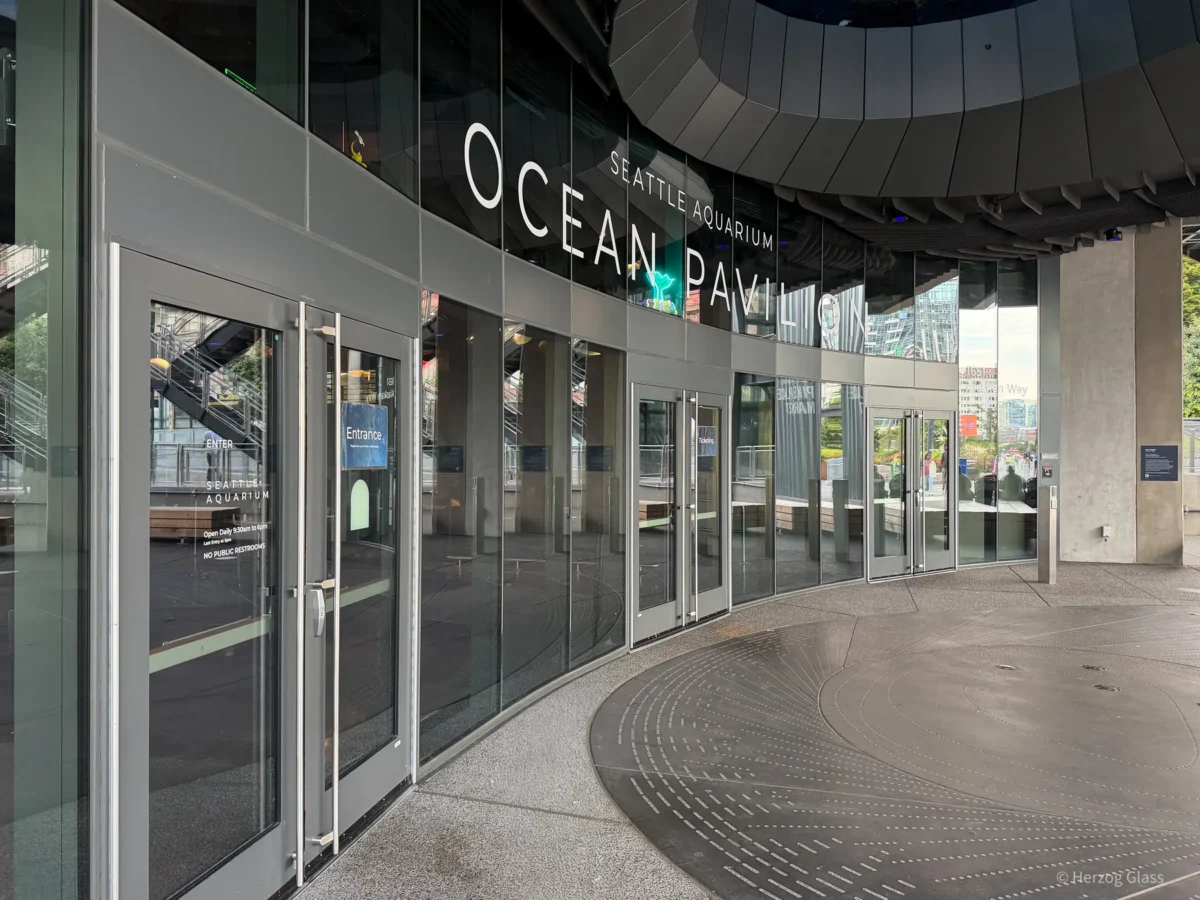 Glazing and storefront entrances at the Seattle Aquarium Ocean Pavilion.