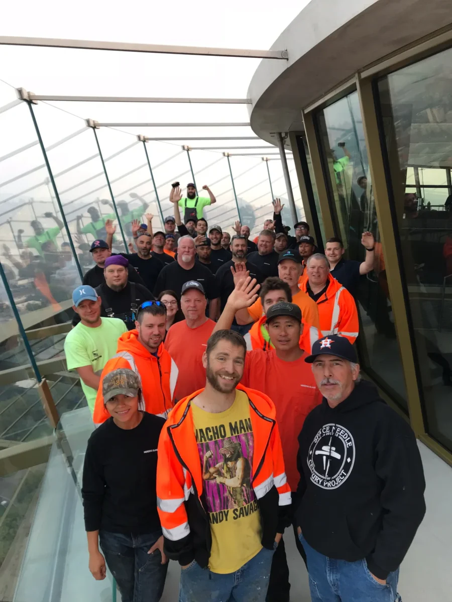 The Herzog Glass crew gathered on the Space Needle observation deck after the glass replacement