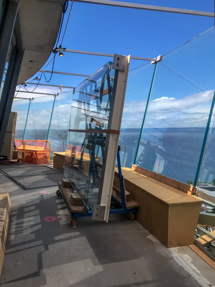 A glass panel rigged and ready to be lifted into place on the observation deck