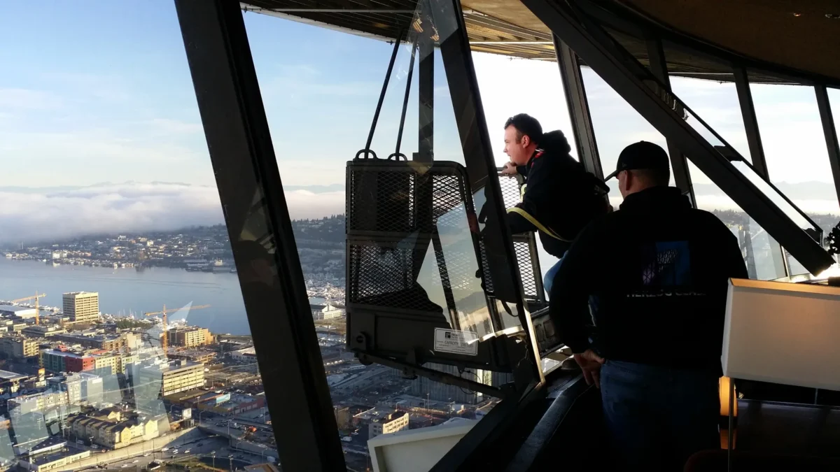 Herzog Glass crew looking out over Seattle through the new observation deck glass