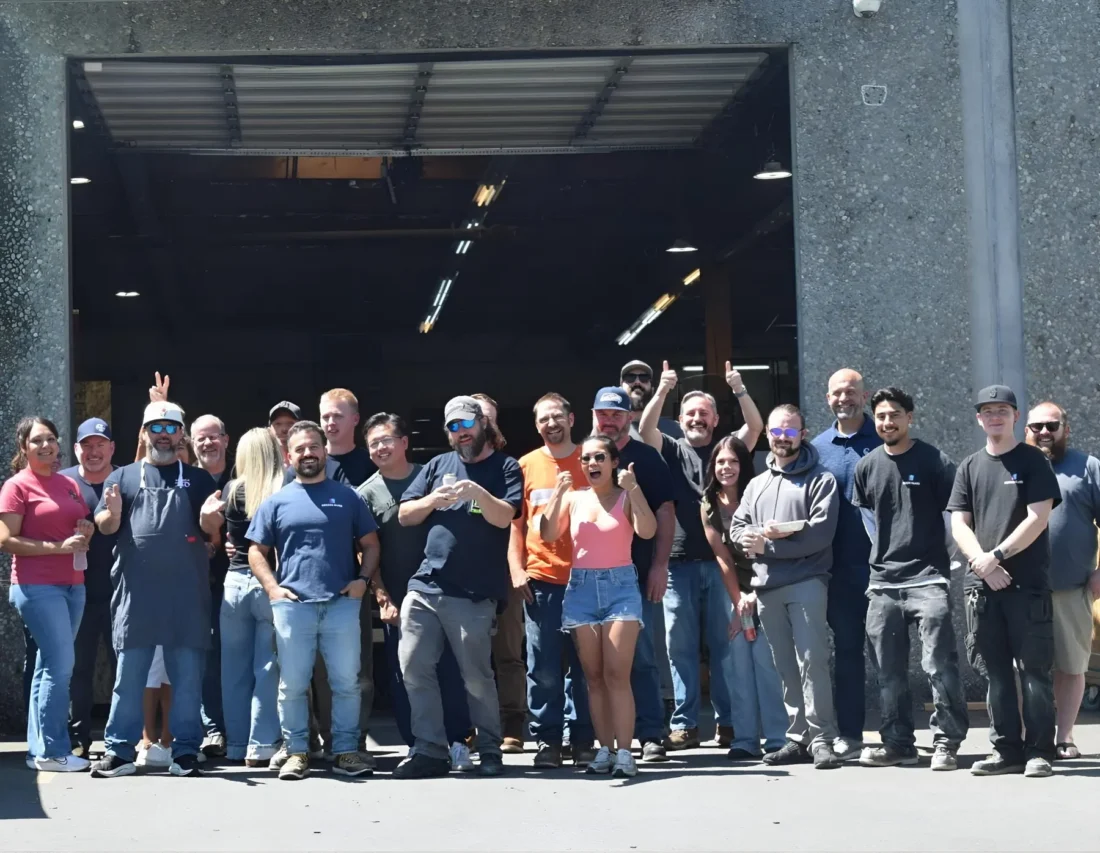 The Herzog Glass crew gathered outside the shop bay door.